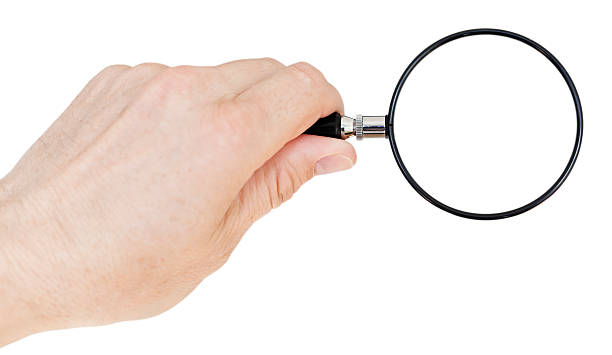 istock Hand holding magnifying glass. Isolated on white background. Copy space. 180811044
