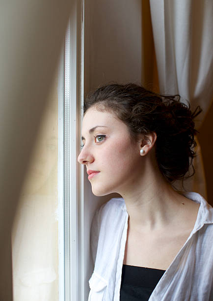 istock Teenage looking through window 180811101