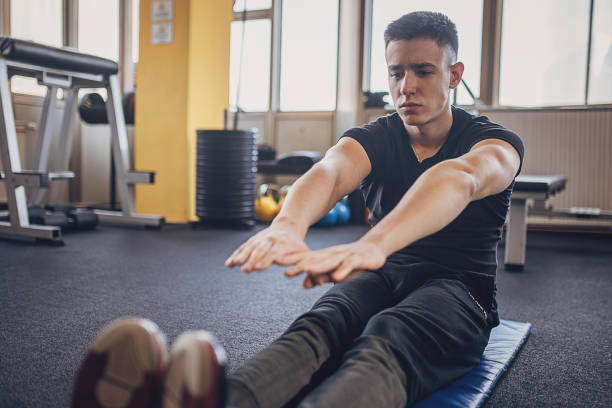 istock Man exercising in gym 1808115503