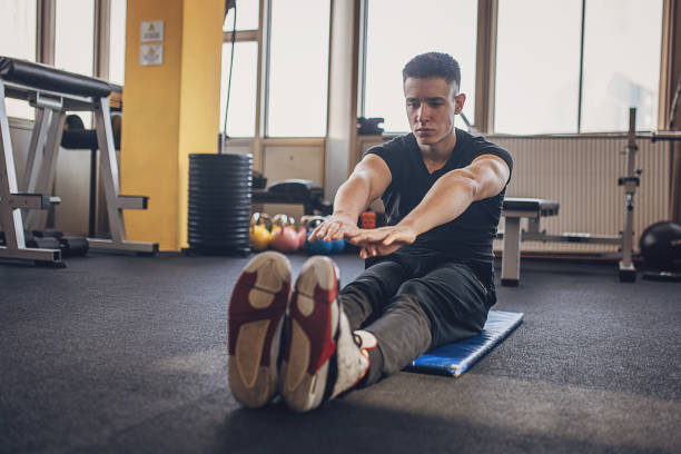 istock Man exercising in gym 1808116027