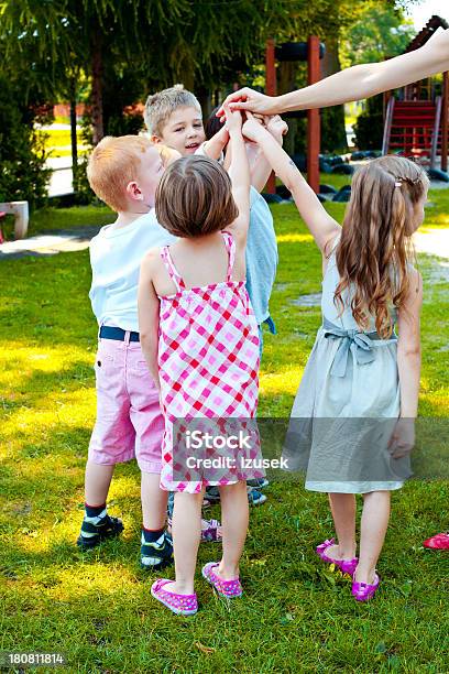 Kids Playing In Garden Stock Photo - Download Image Now - Child, Green Color, Human Hand