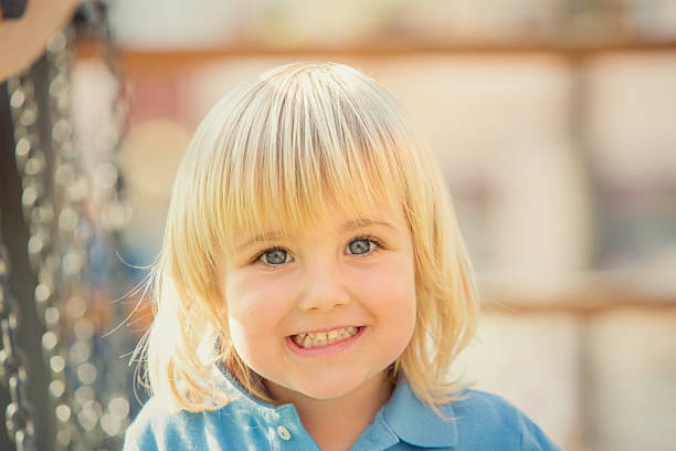 istock happy children are playing in the park 180811856