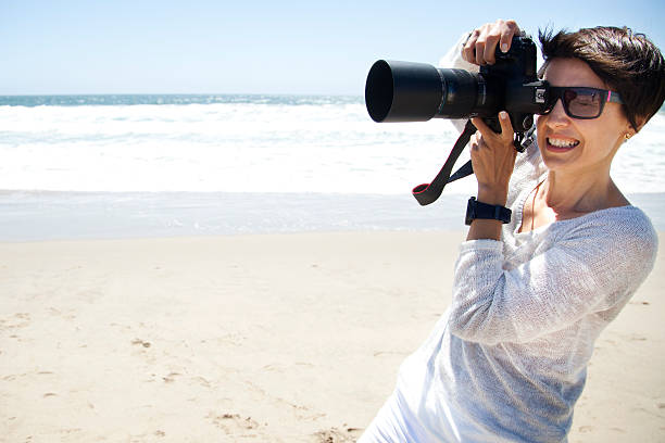 istock Photographer on the beach 180812141