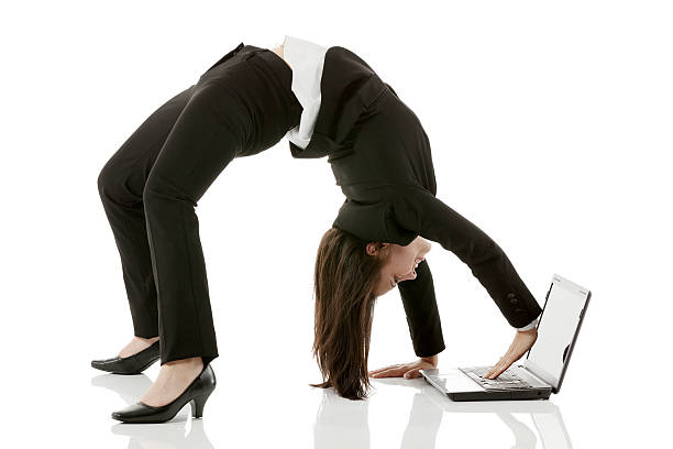 istock Businesswoman arching her back and using laptop 180812180