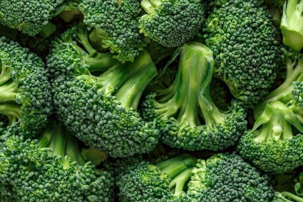 istock Macro photo green fresh vegetable broccoli. Fresh green broccoli on a black stone table.Broccoli vegetable is full of vitamin.Vegetables for diet and healthy eating.Organic food. 1808122077