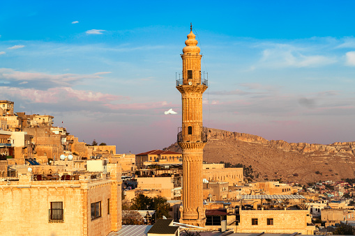 Historical Mardin city view, built on the top of the mountain. Historical minarets, one of the symbols of the city, were photographed from the top. Shot with a full-frame camera during the day.