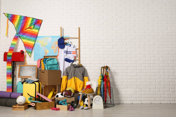 istock Many different stuff near white brick wall, space for text. Garage sale 1808123709