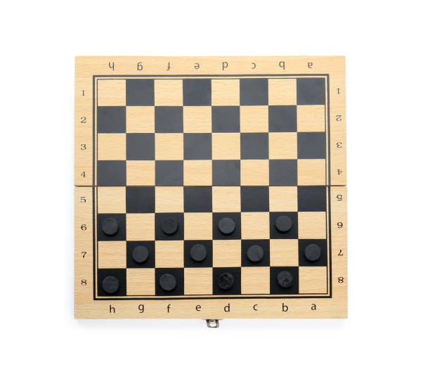 istock Wooden checkerboard with game pieces isolated on white, top view 1808123712