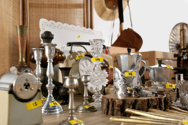 istock Many different items on wooden table indoors. Garage sale 1808123742