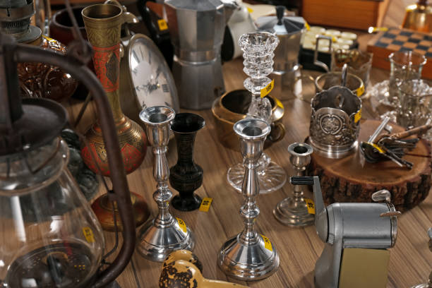 istock Many different items on wooden table. Garage sale 1808123745