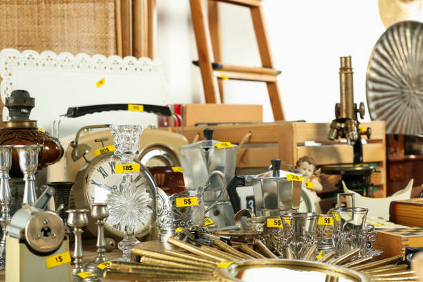 istock Many different items on wooden table indoors. Garage sale 1808124841