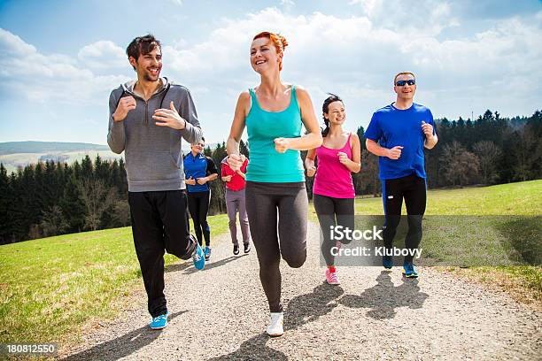 Friends Running In Mountain Scenery Stock Photo - Download Image Now - Jogging, Summer, 20-29 Years