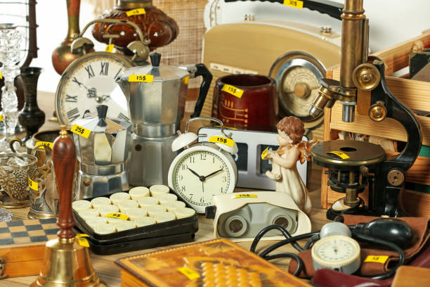 istock Many different items on wooden table indoors. Garage sale 1808125924