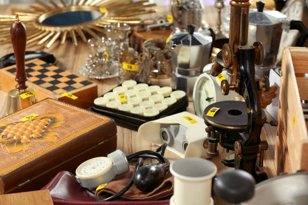 istock Many different items on wooden table. Garage sale 1808125944