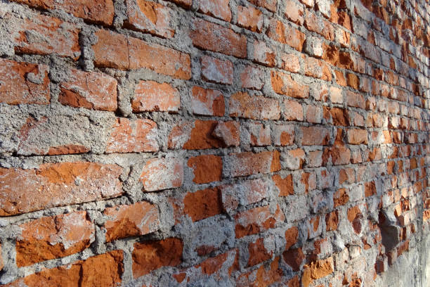istock brick wall being demolished for external renovation of the building - horizontal 1808127524
