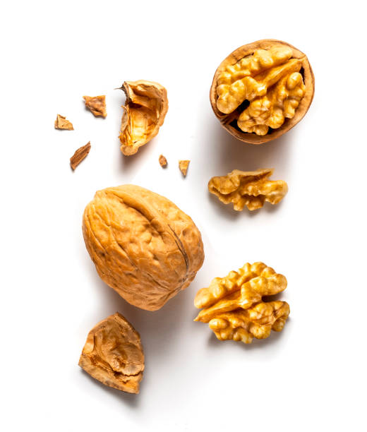 istock one whole and one open walnut isolated on white background vertical 1808128062