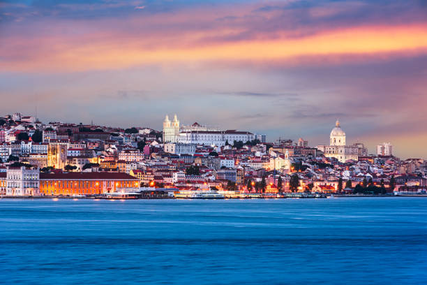 Lisbon, Portugal skyline on the Tagus River at dusk.