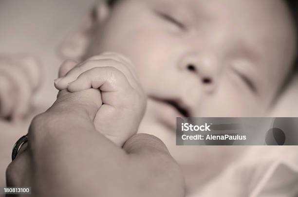 Mother Holding Babys Hand Stock Photo - Download Image Now - 0-11 Months, Affectionate, Baby - Human Age