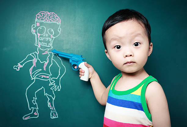 istock Cute child in front of the blackboard 180814114