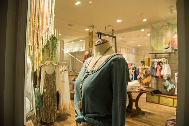 istock Fashion: Women's clothing in a downtown window display. 180814697