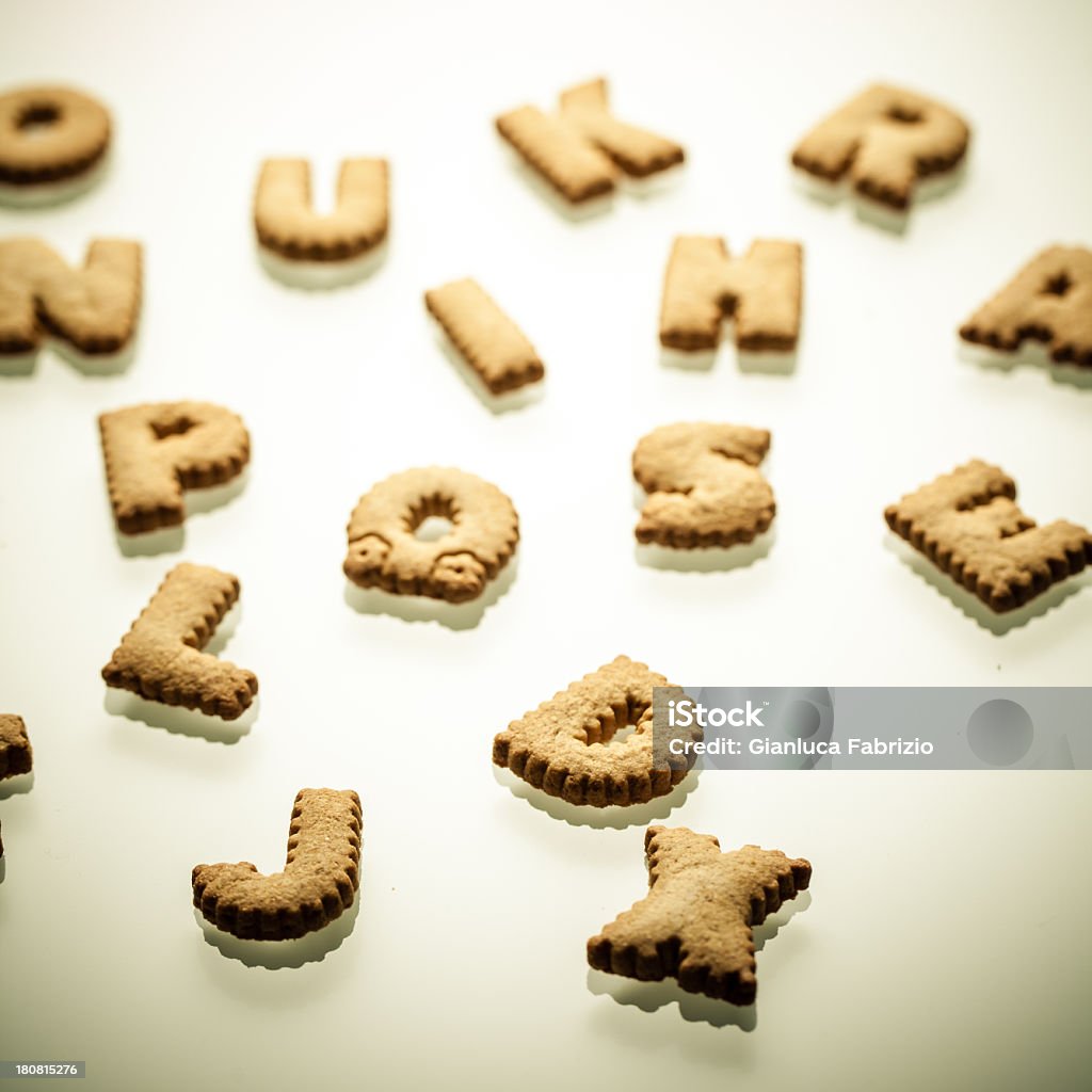 Shortbread Letters Square macro portrait of delicious shortbread biscuits shaped as alphabet letters. Digital vignetting added. Alphabet Stock Photo
