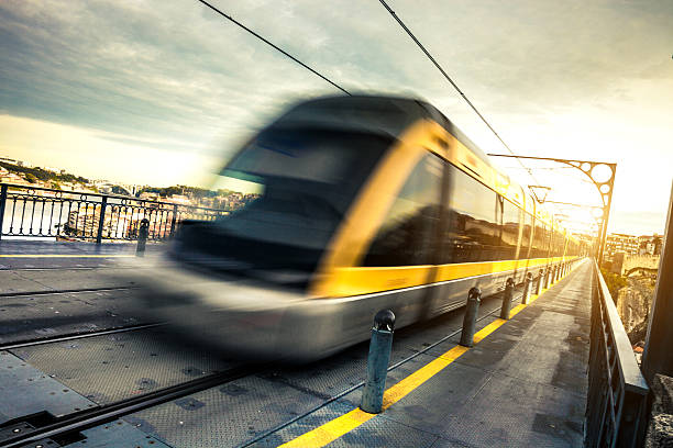 istock Metro train passes on a long suspended bridge 180815434