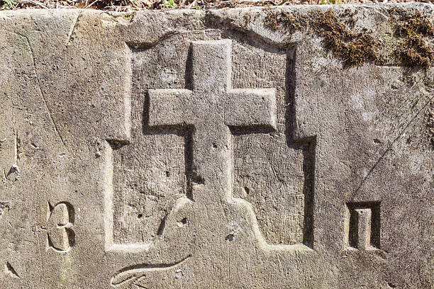 istock Stone Cross In Old Catholic Cemetery 180815543