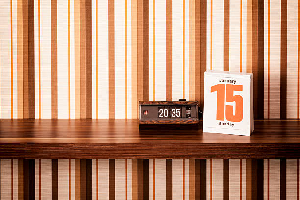 istock Retro style alarm clock and calendar on shelf 180815668