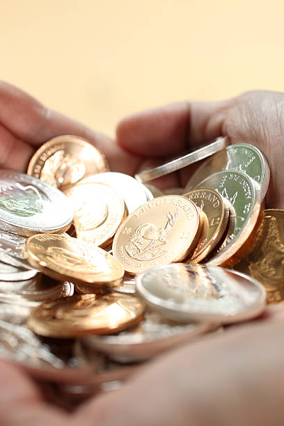istock Handful of Gold and Silver Coins 180816453