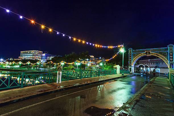 The Chamberlain Bridge and Bridgetown downtown by night. At one end of the bridge is the Independence Arch, built in 1987 to commemoration the 21st anniversary of the independence from Britain, occurred in 1966. Barbados.