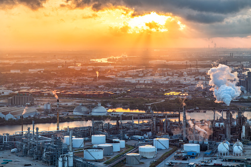 Texas refineries and other industry along the Buffalo Bayou dredged to form the Houston Ship Channel located about 4 miles east of downtown Houston, Texas shot aerially via helicopter from an altitude of about 500 feet at sunrise.