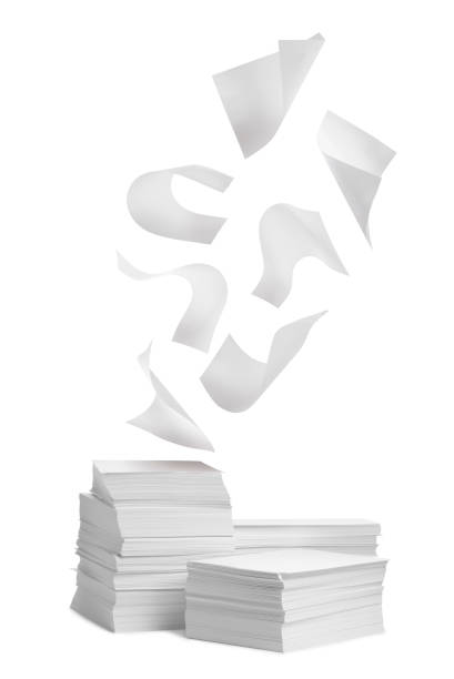 istock Sheets of paper falling onto stacked ones on white background 1808170395