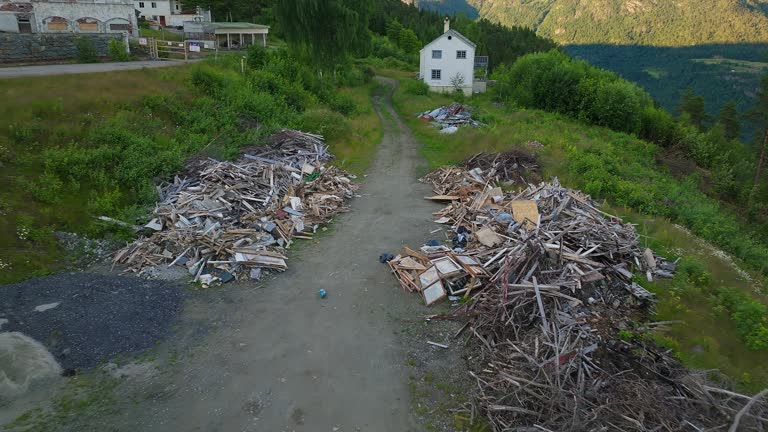 Piles of debris in front of haunted Luster Sanatorium, Norway. Aerial