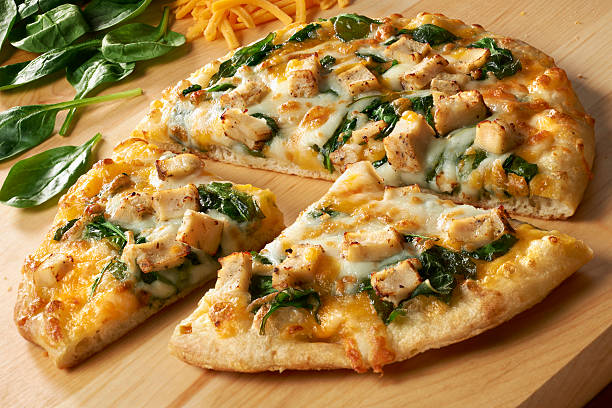 Small Pizza with Chicken, Spinach and double cheese stock photo
