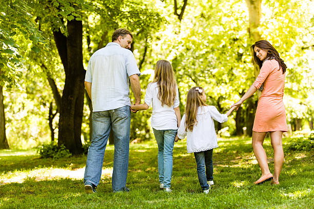 istock Family walking in the park 180817483