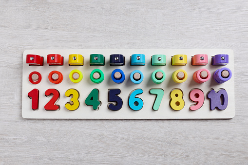 Math game Fishing for Numbers on white wooden table, top view