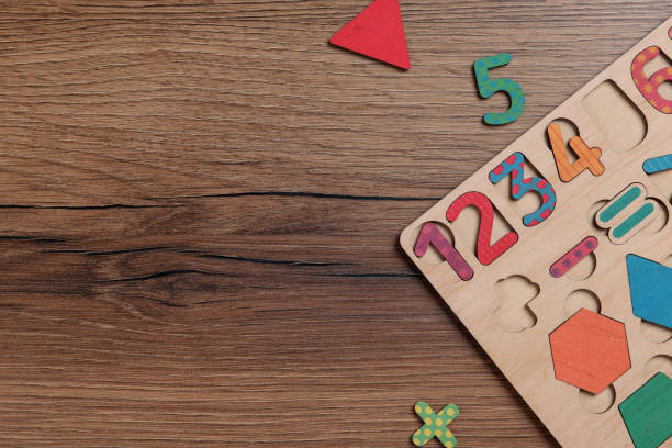 istock Math game kit for children on wooden table, flat lay. Space for text 1808177939