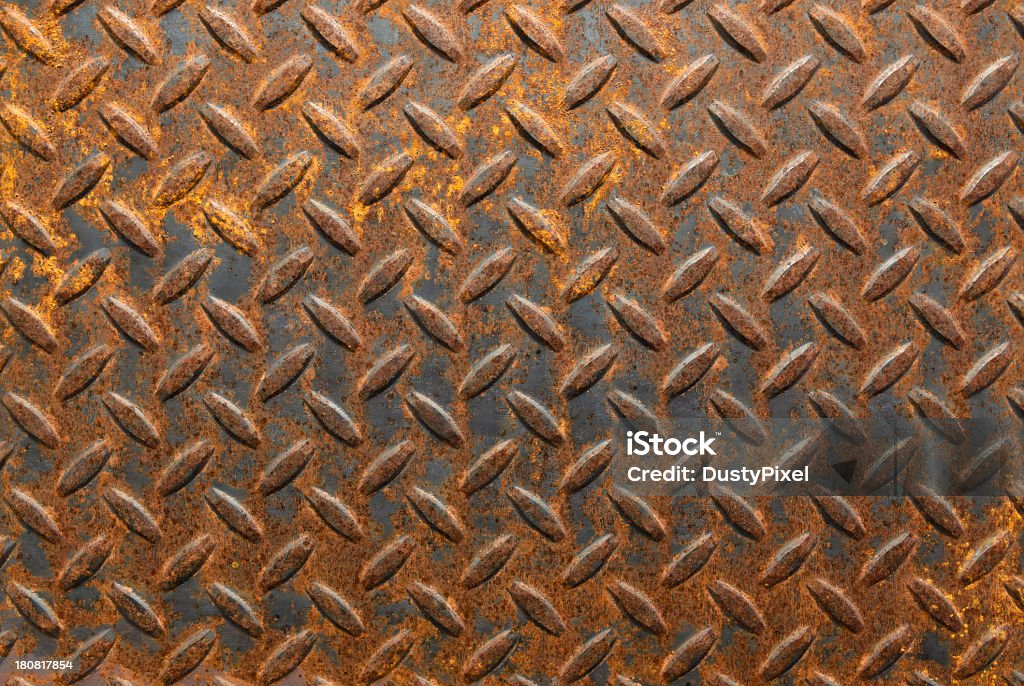 A brown rustic metallic background Old rusty diamond plate steel section Backgrounds Stock Photo