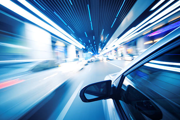 A car driving through a tunnel at night