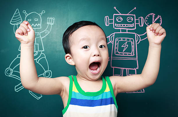 istock Cute child in front of the blackboard 180817908
