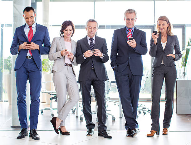 istock Business partners texting on their phones 180818292