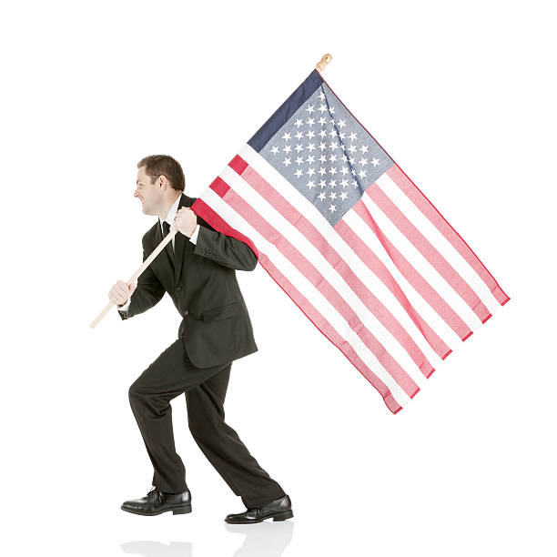 istock Businessman carrying an American flag 180818485