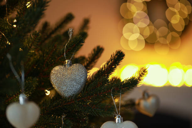 istock Beautiful Christmas tree decorated with festive lights and baubles indoors, space for text. Bokeh effect 1808196293