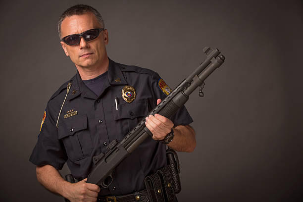 istock Policeman with a tactical shotgun 180820024