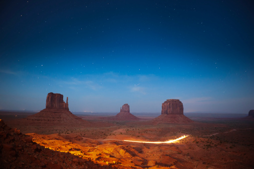 Subject: The landscape of Monument Valley, the American southwest under the stary night sky.