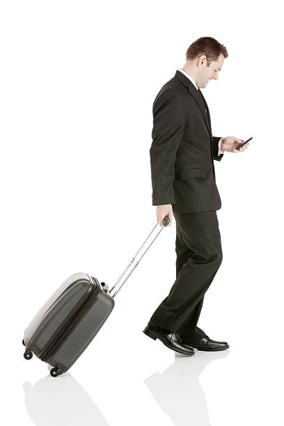 istock young businessman walking in white background 180820403