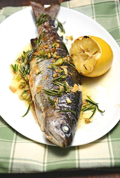 istock Trout baked with herbs and lemon 180820407
