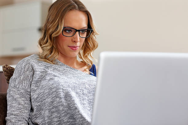 istock Beautiful young lady working from home 180820474