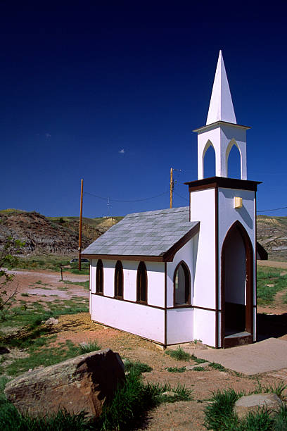 little church - steeple outdoors vertical alberta stock-fotos und bilder