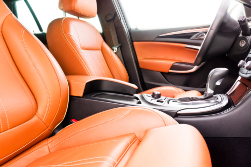 Luxurious vehicle interior front seats with full leather.